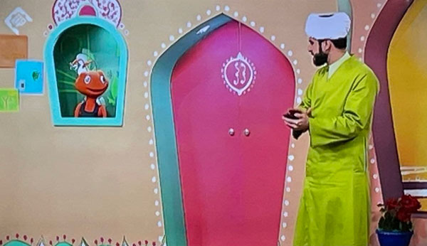 روحانی با لباس فسفری در شبکه قرآن