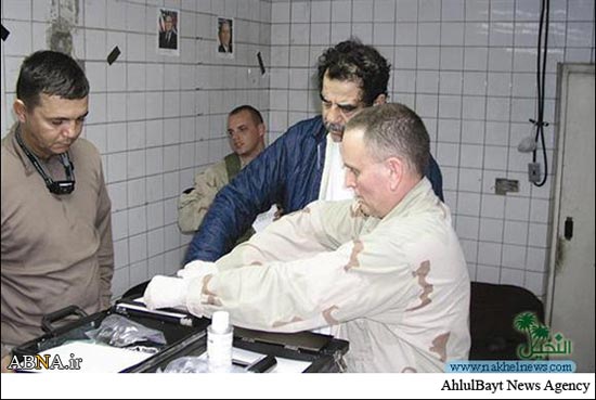 عکس روز: لحظه به دام افتادن صدام حسین